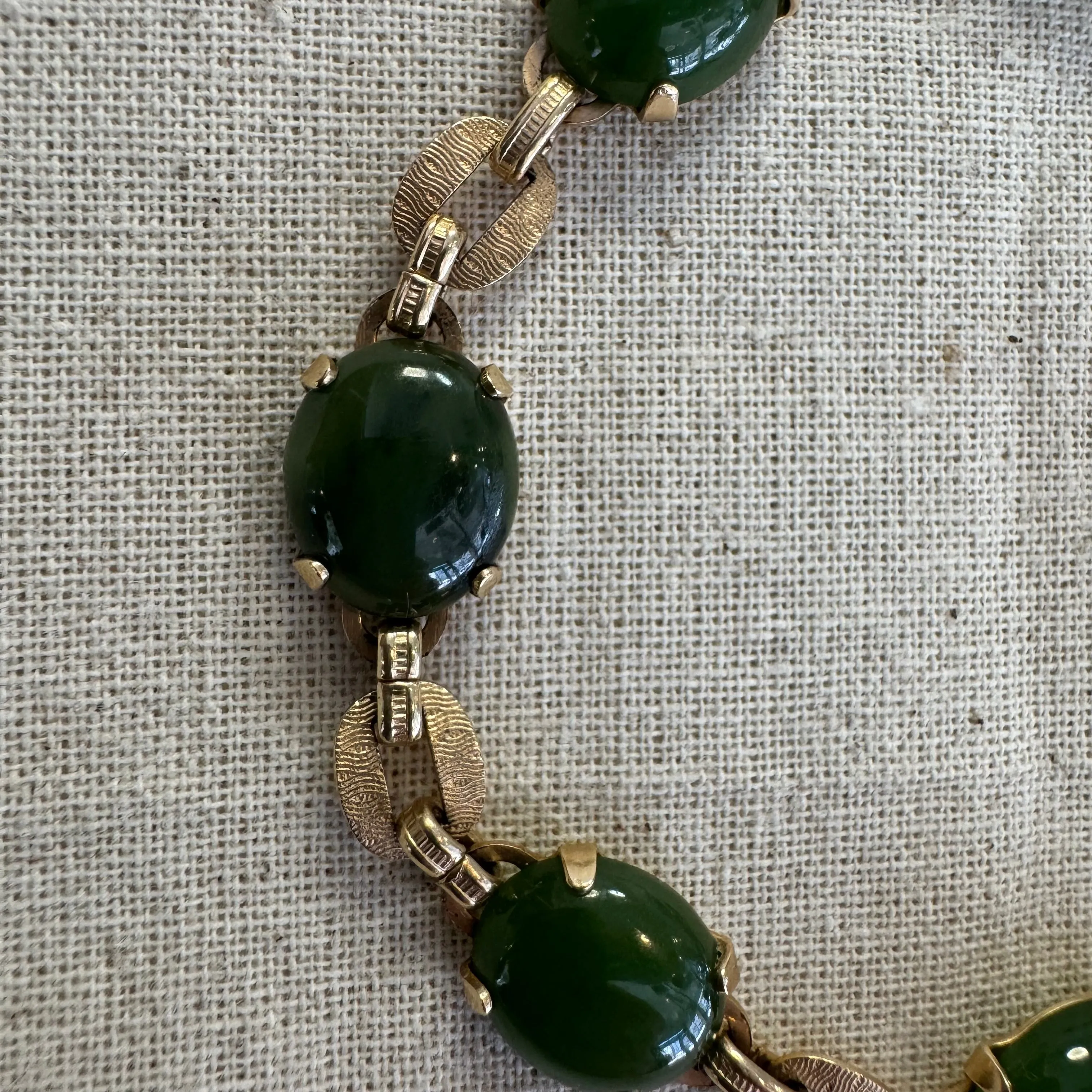 14K gold bracelet set with oval green Jade cabochons and textured gold links