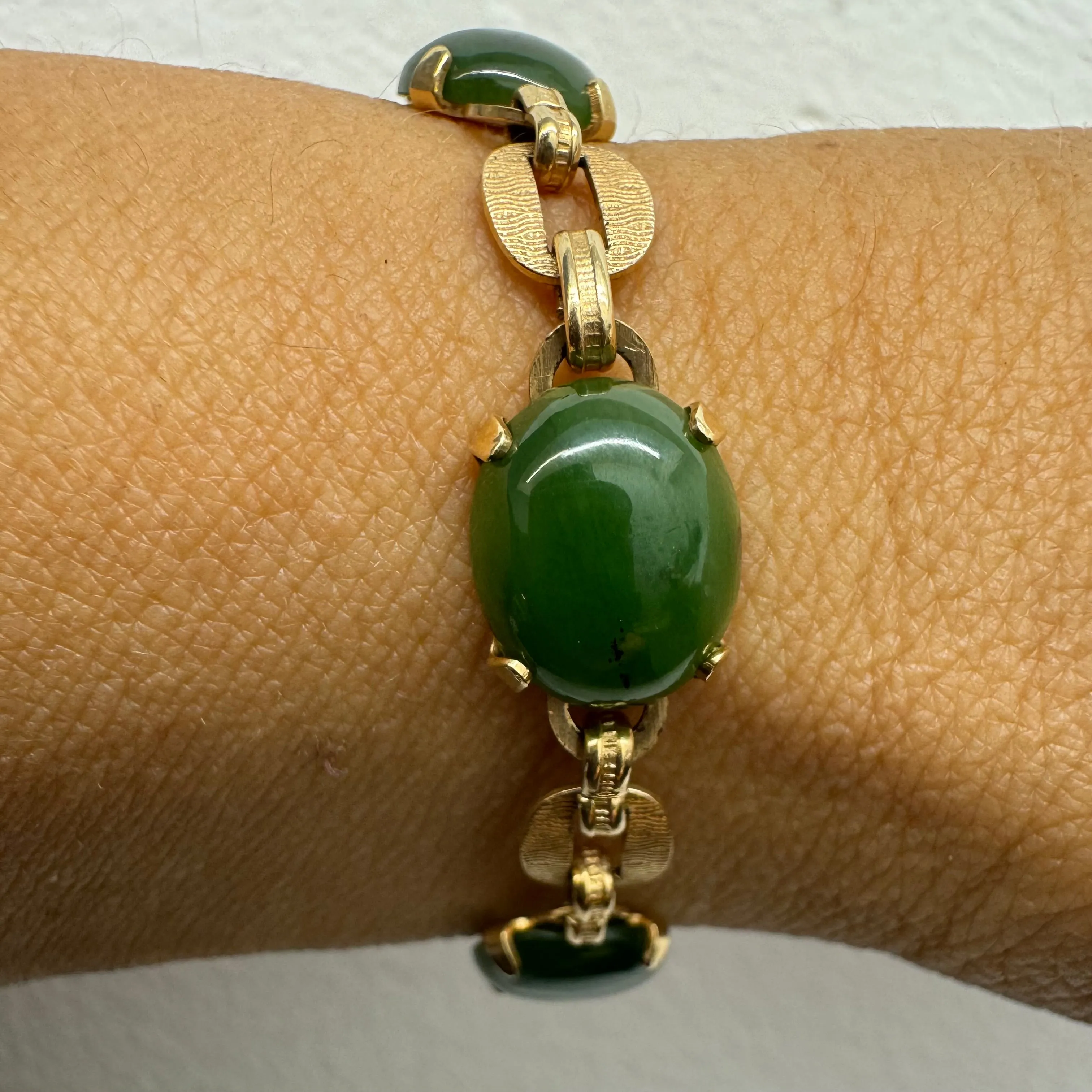 14K gold bracelet set with oval green Jade cabochons and textured gold links