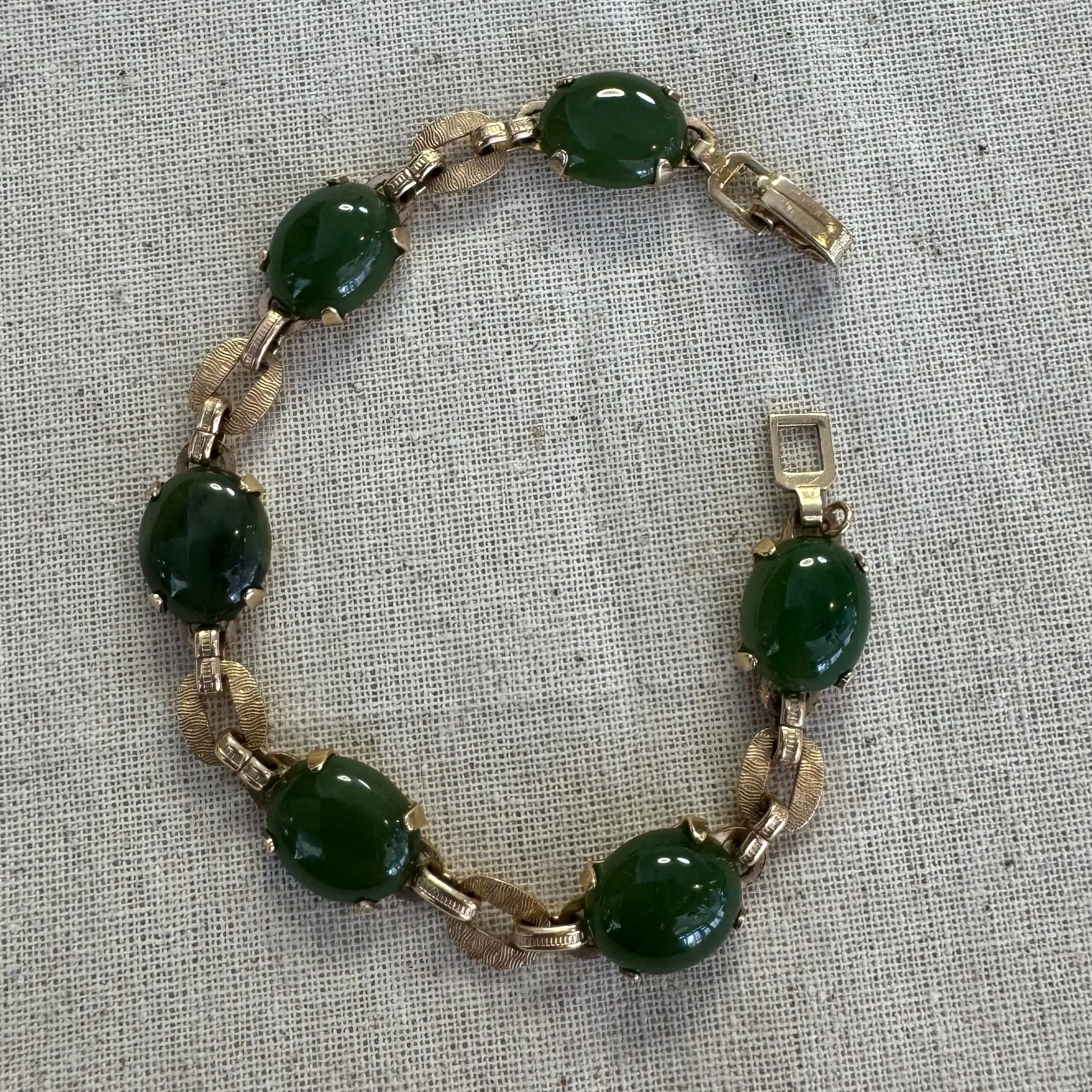 14K gold bracelet set with oval green Jade cabochons and textured gold links