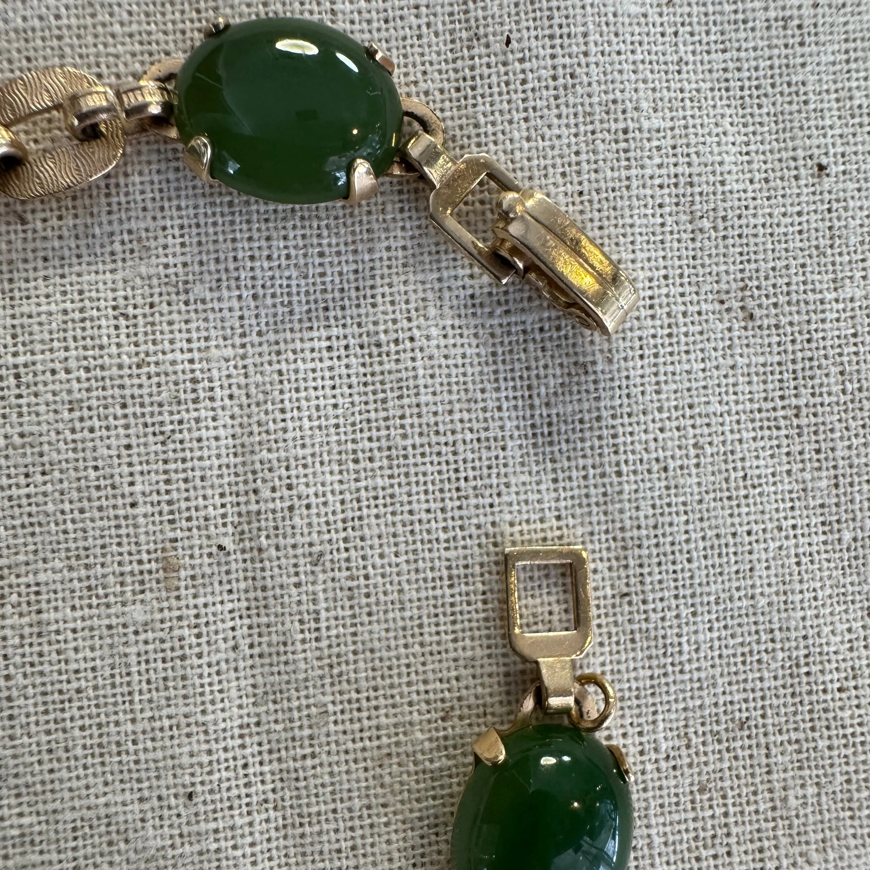 14K gold bracelet set with oval green Jade cabochons and textured gold links