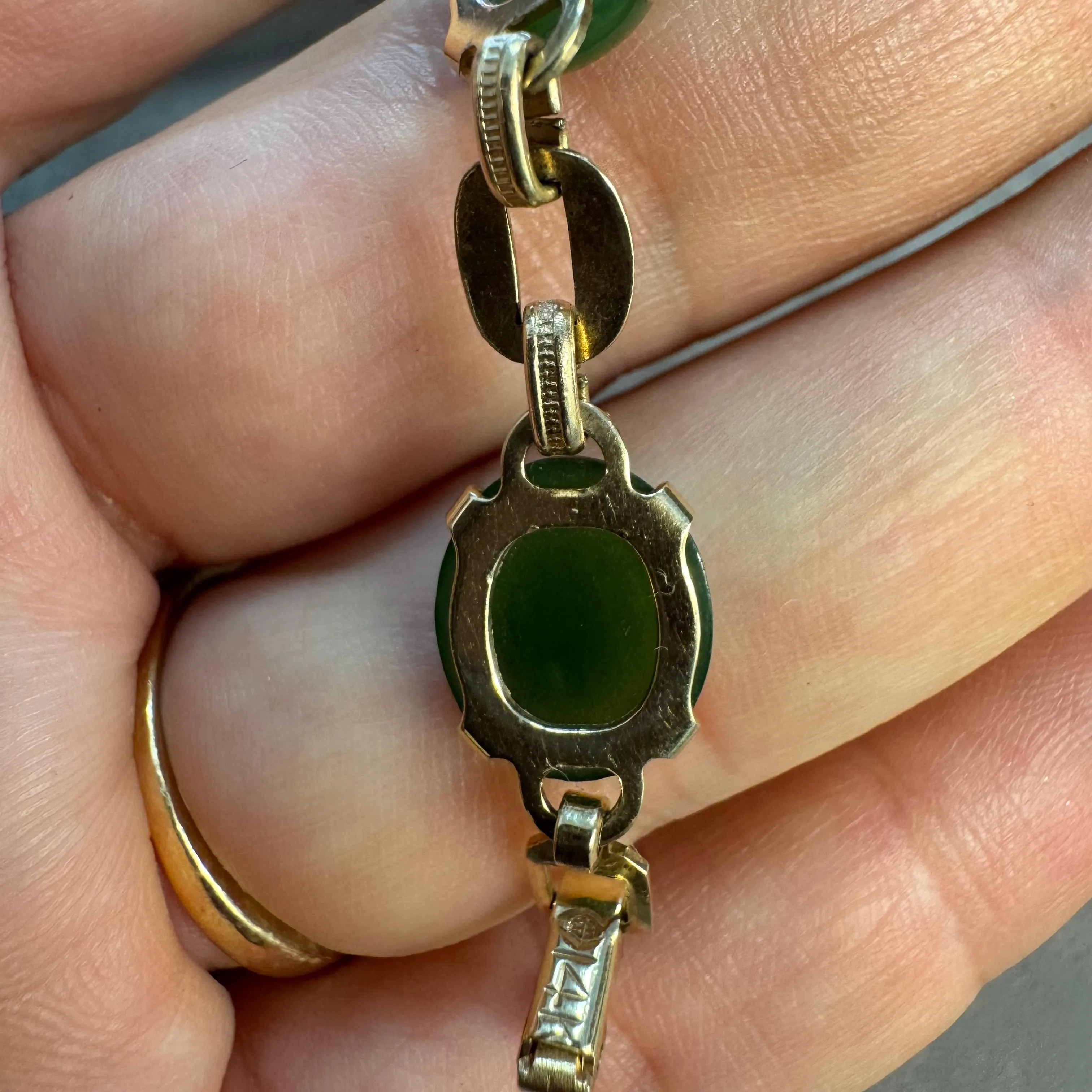 14K gold bracelet set with oval green Jade cabochons and textured gold links