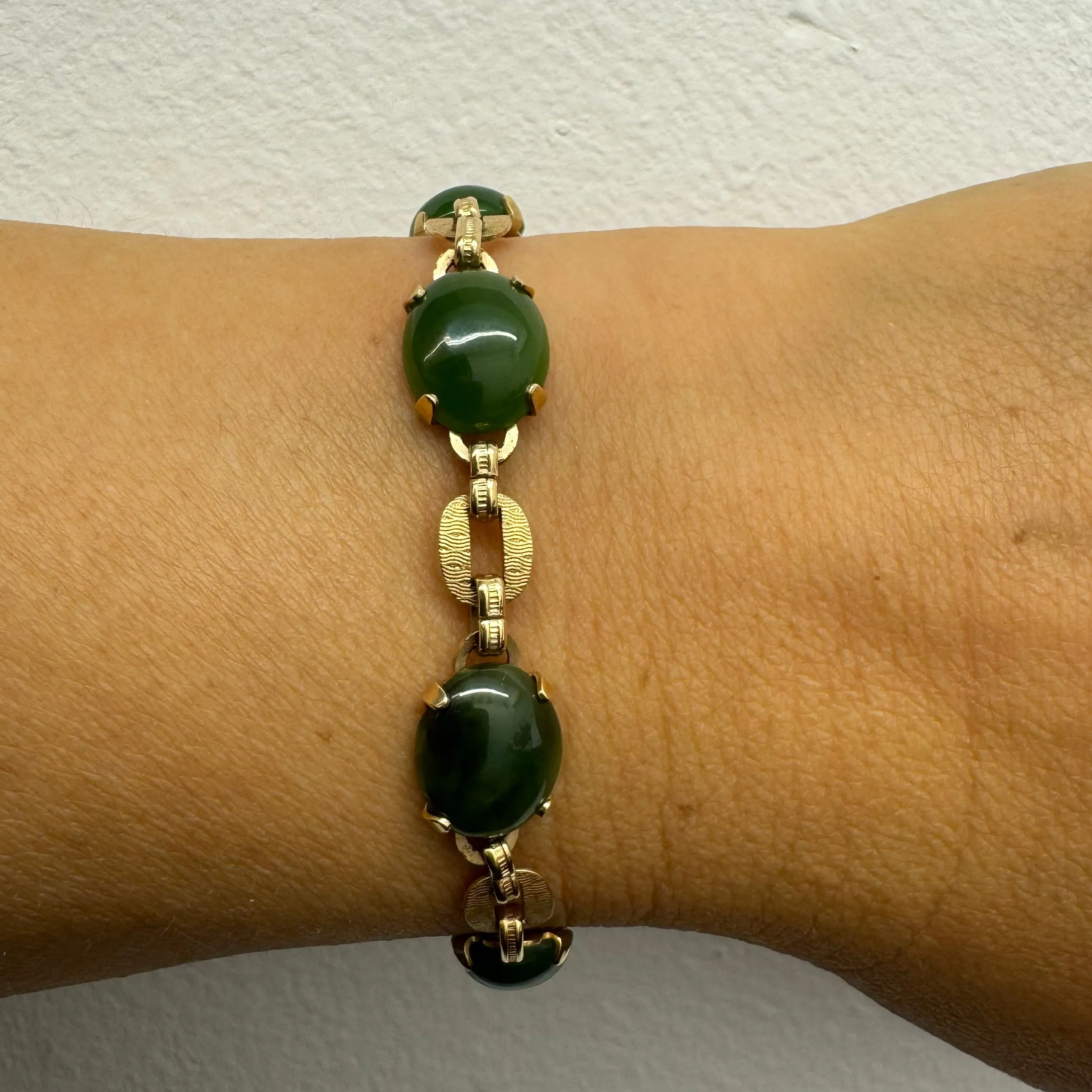 14K gold bracelet set with oval green Jade cabochons and textured gold links