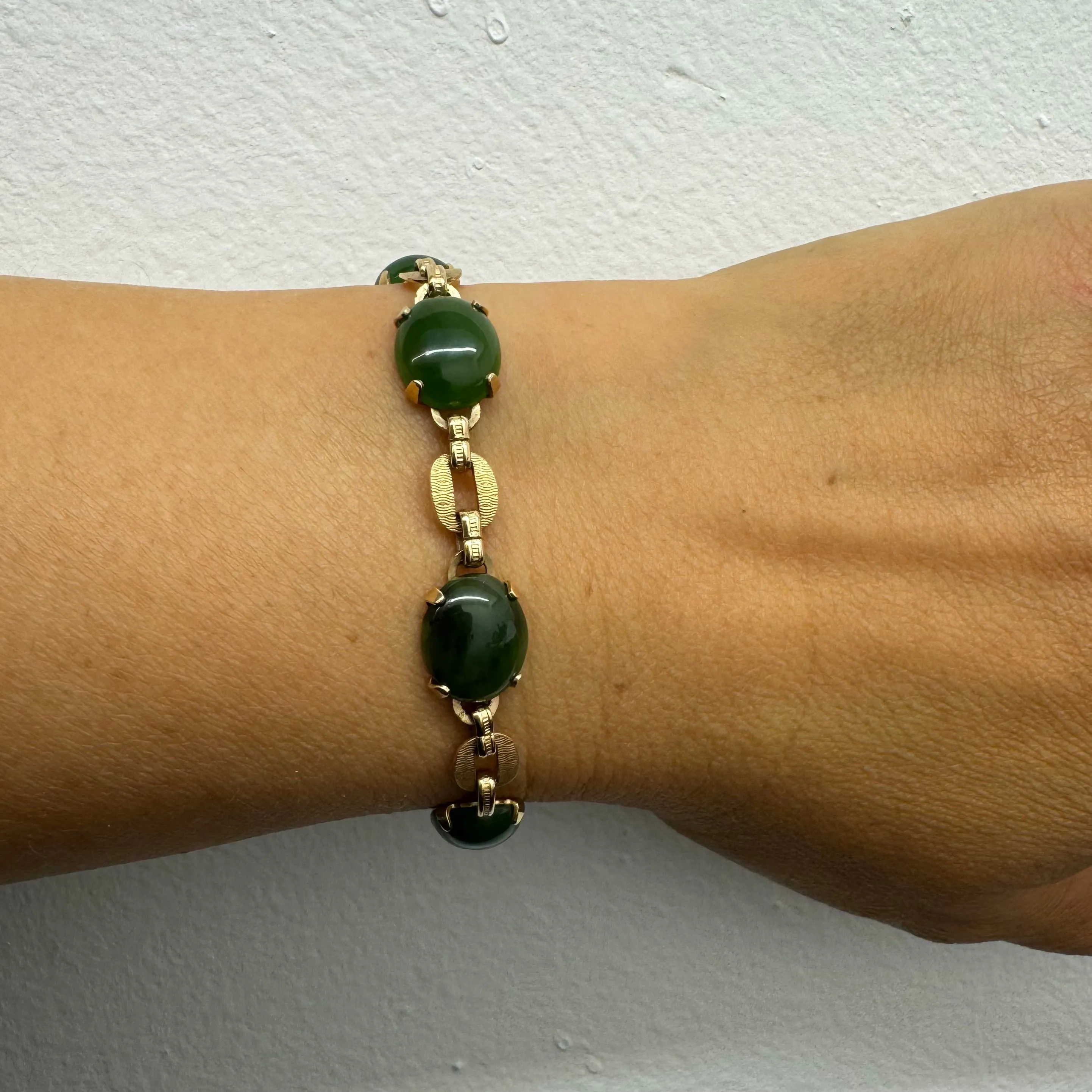 14K gold bracelet set with oval green Jade cabochons and textured gold links