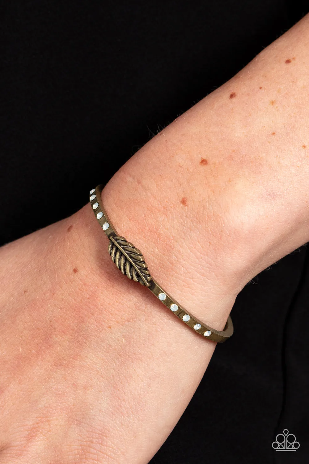 Free-Spirited Shimmer - Brass - Feather White Opalescent Rhinestone Feather Paparazzi Cuff Bracelet