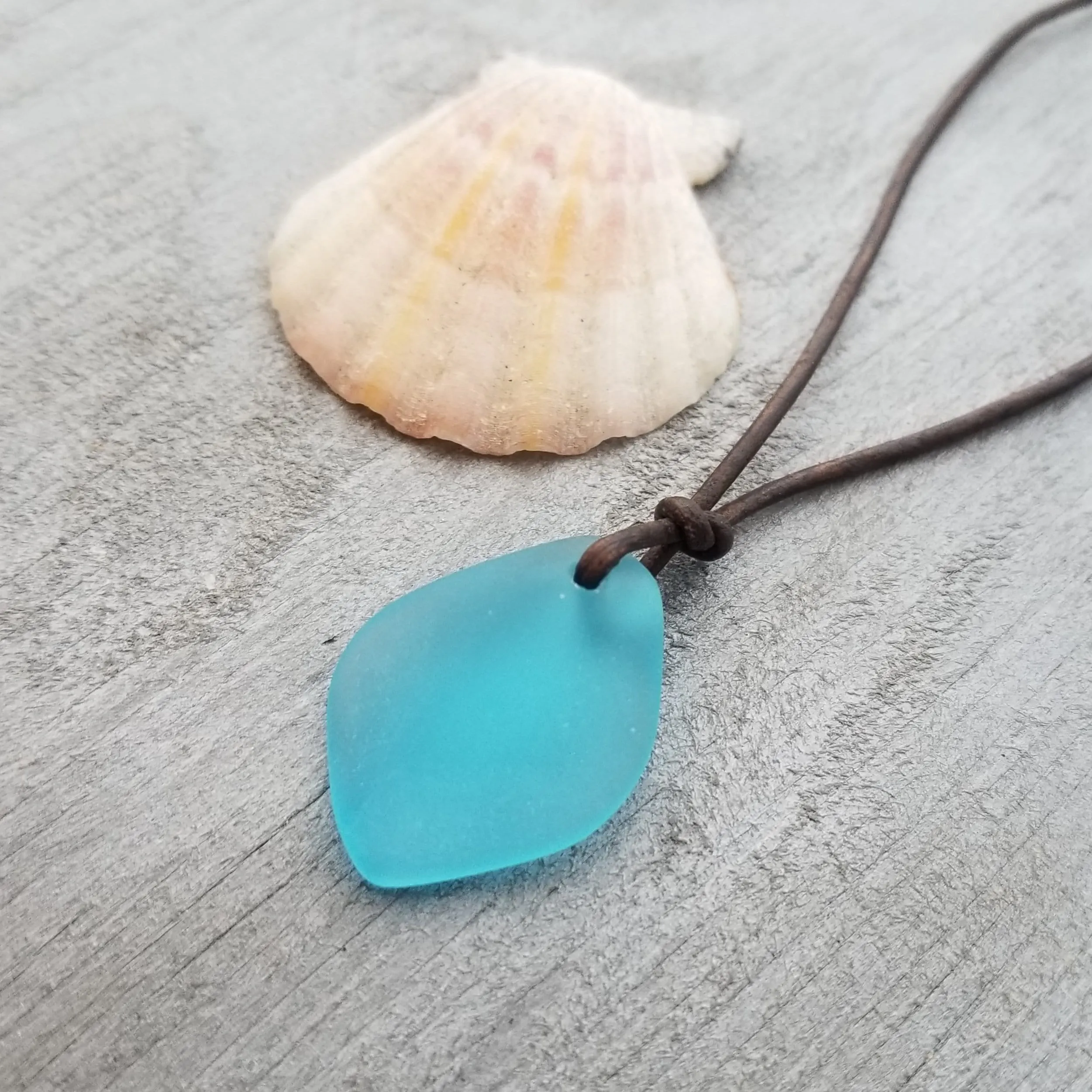 Handmade in Hawaii, leather cord unisex puff blue sea glass necklace, unisex jewelry, birthday gift, sea glass jewelry