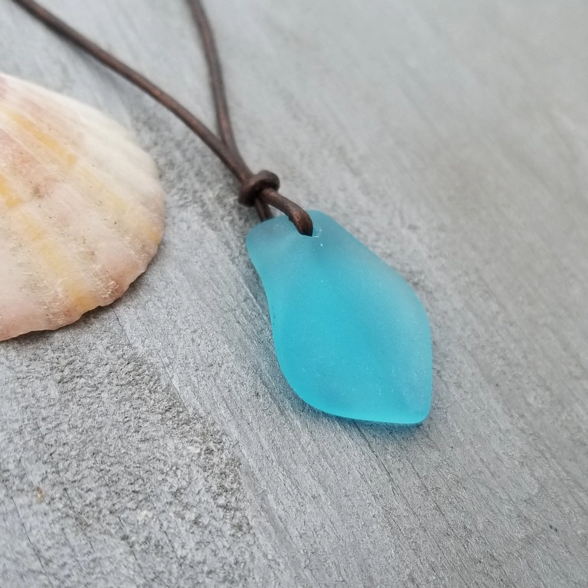 Handmade in Hawaii, leather cord unisex puff blue sea glass necklace, unisex jewelry, birthday gift, sea glass jewelry