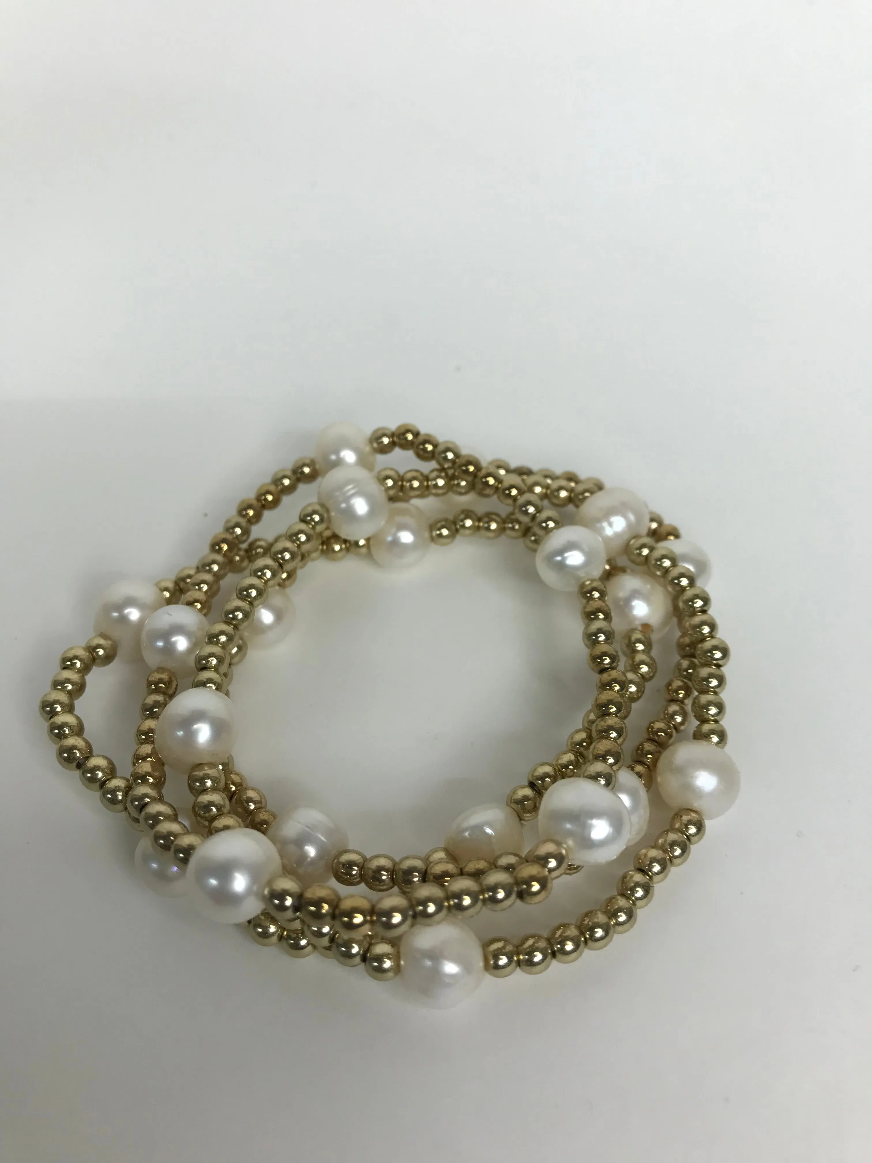 Pearl and gold bead stacks Bracelets