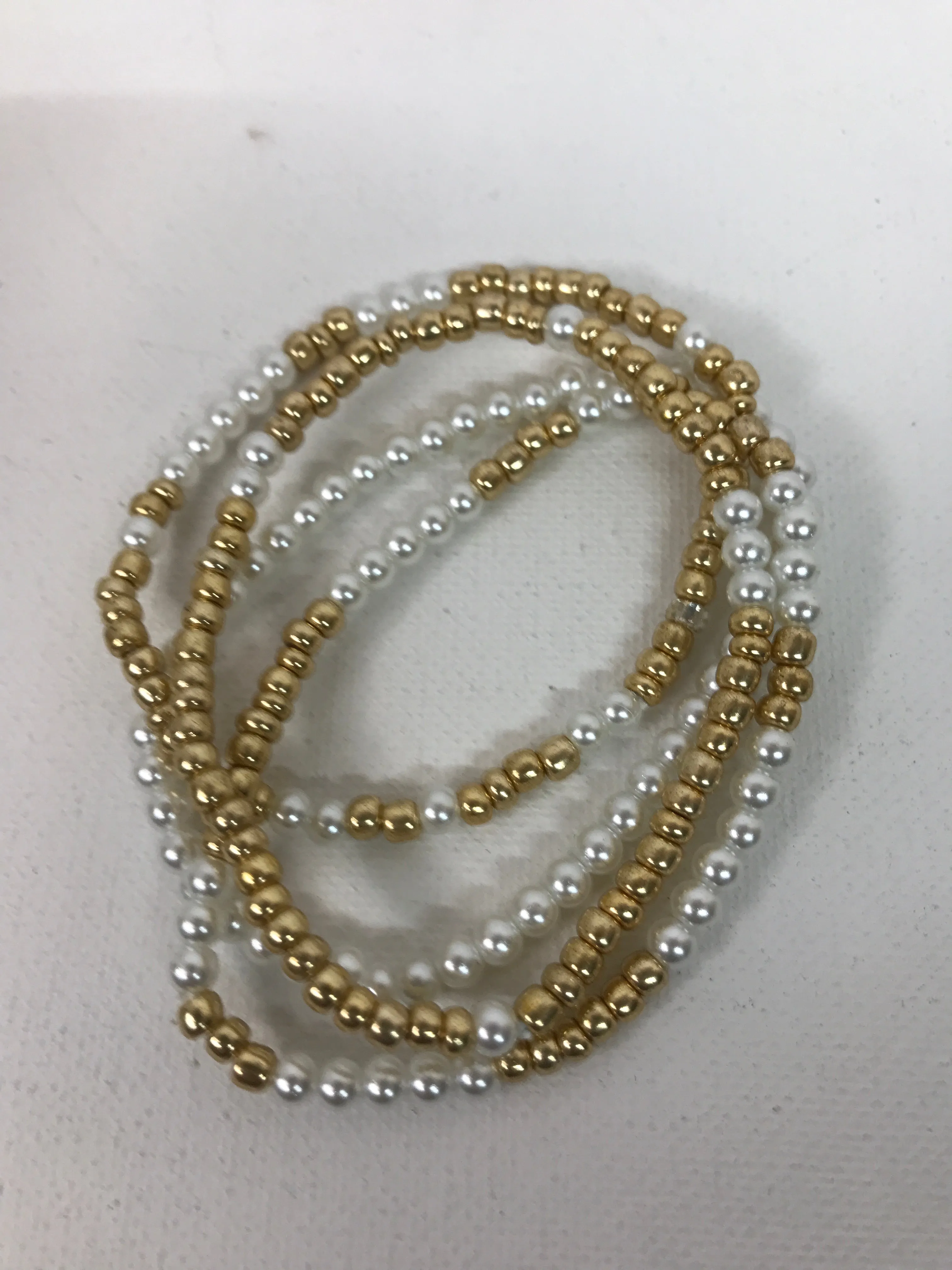 Pearl and gold bead stacks Bracelets