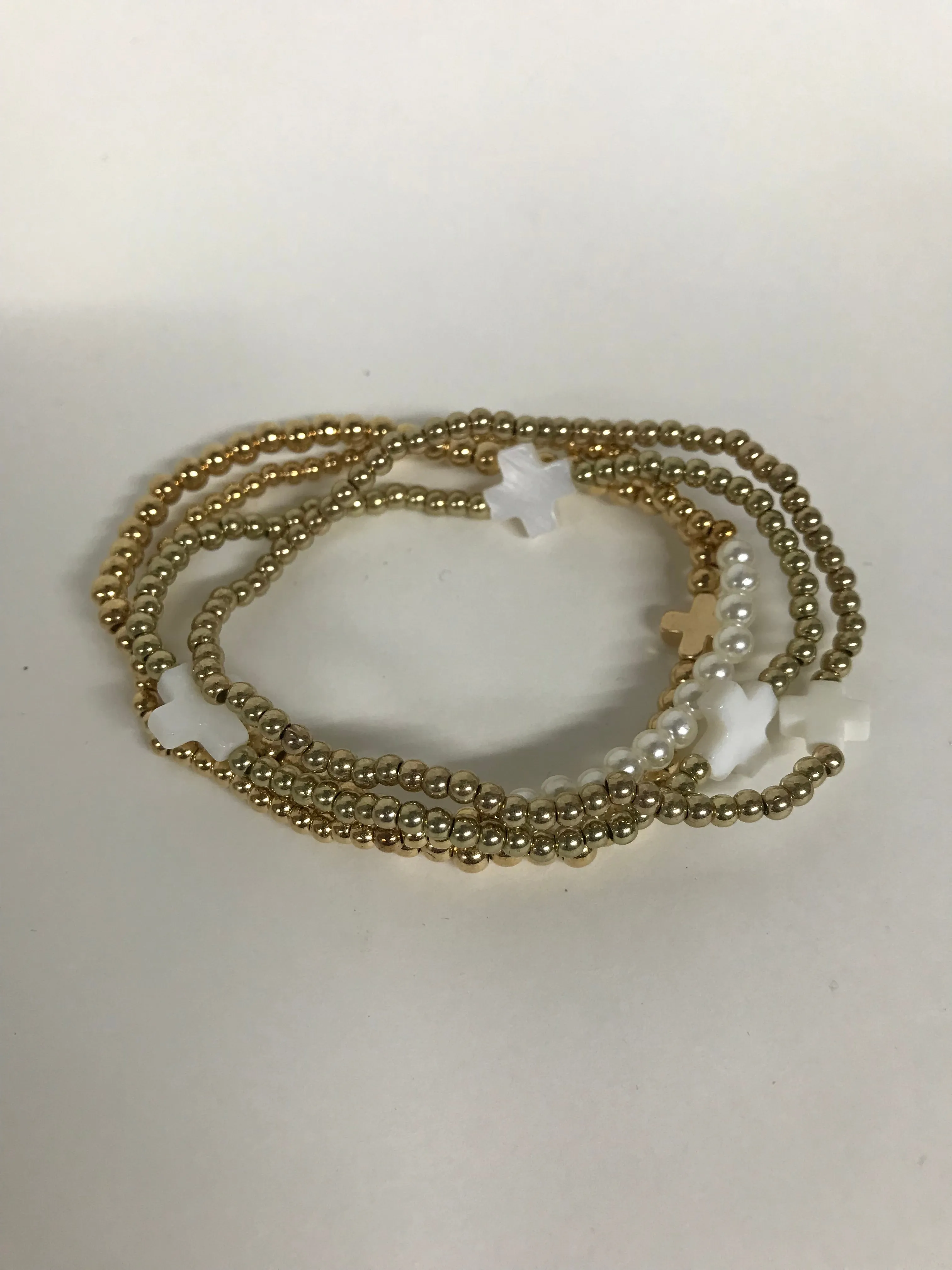 Pearl and gold bead stacks Bracelets