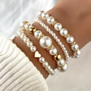Set of 4 bracelets with faux pearls