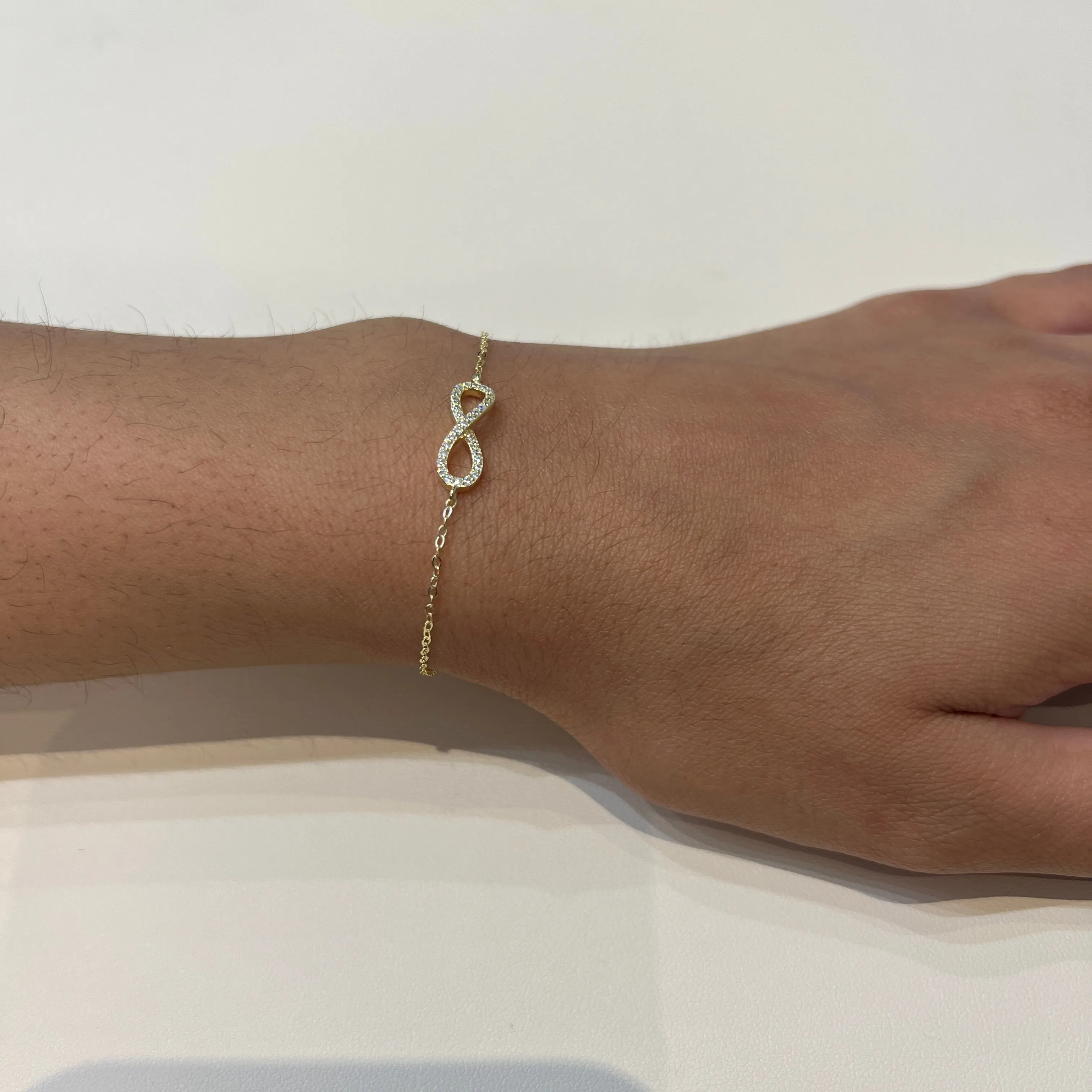Silver CZ Sideway Infinity Yellow Gold Plated Bracelet