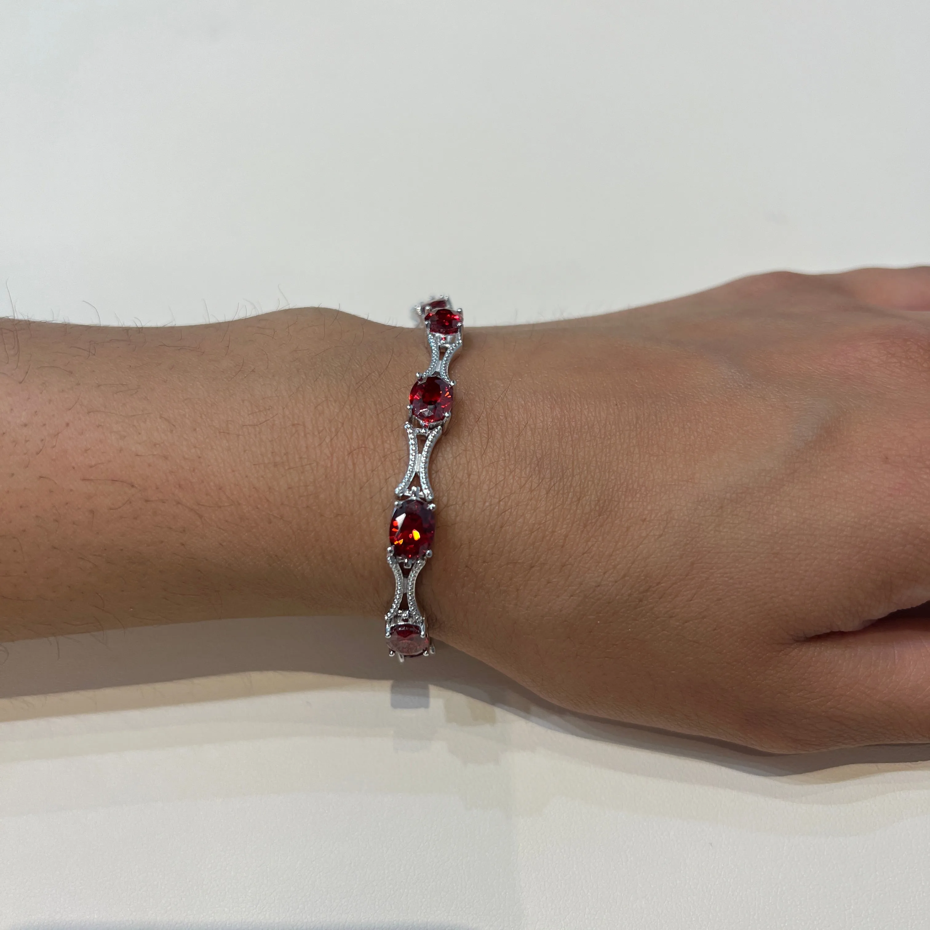 Sterling Silver Rhodium Plated Red Oval CZ Tennis Bracelet