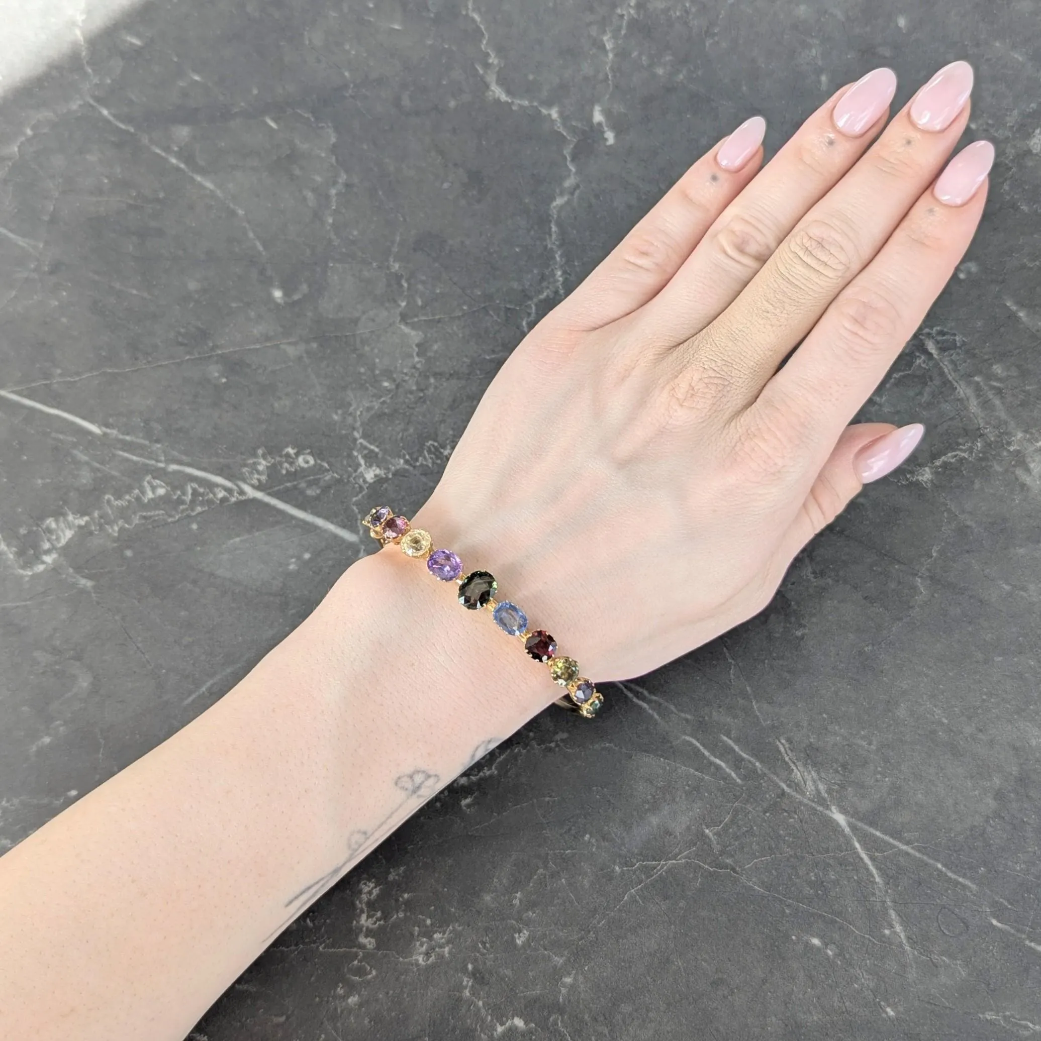 Victorian 16.38 CTW Sapphire Garnet 14 Karat Yellow Gold Antique Harlequin Bangle Bracelet